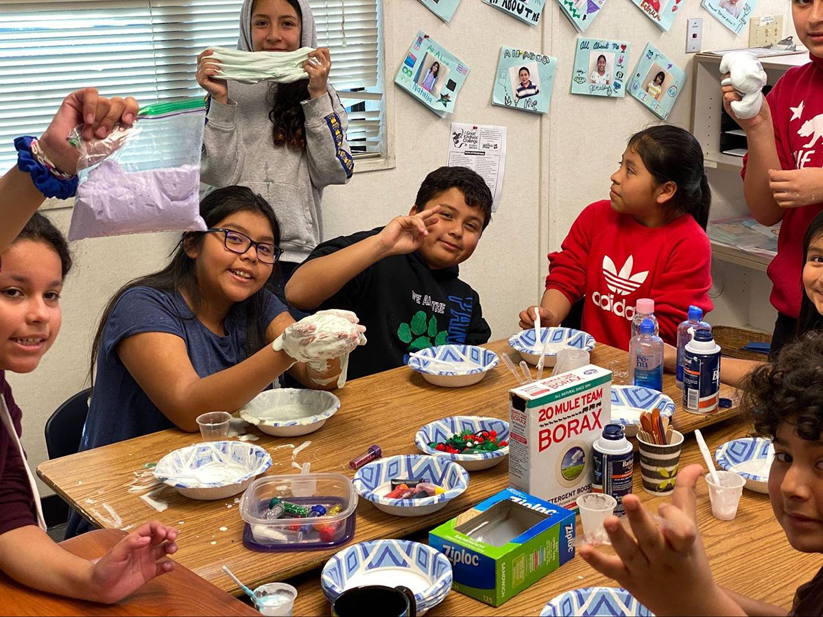 group of 3rd and 4th graders making borax slime